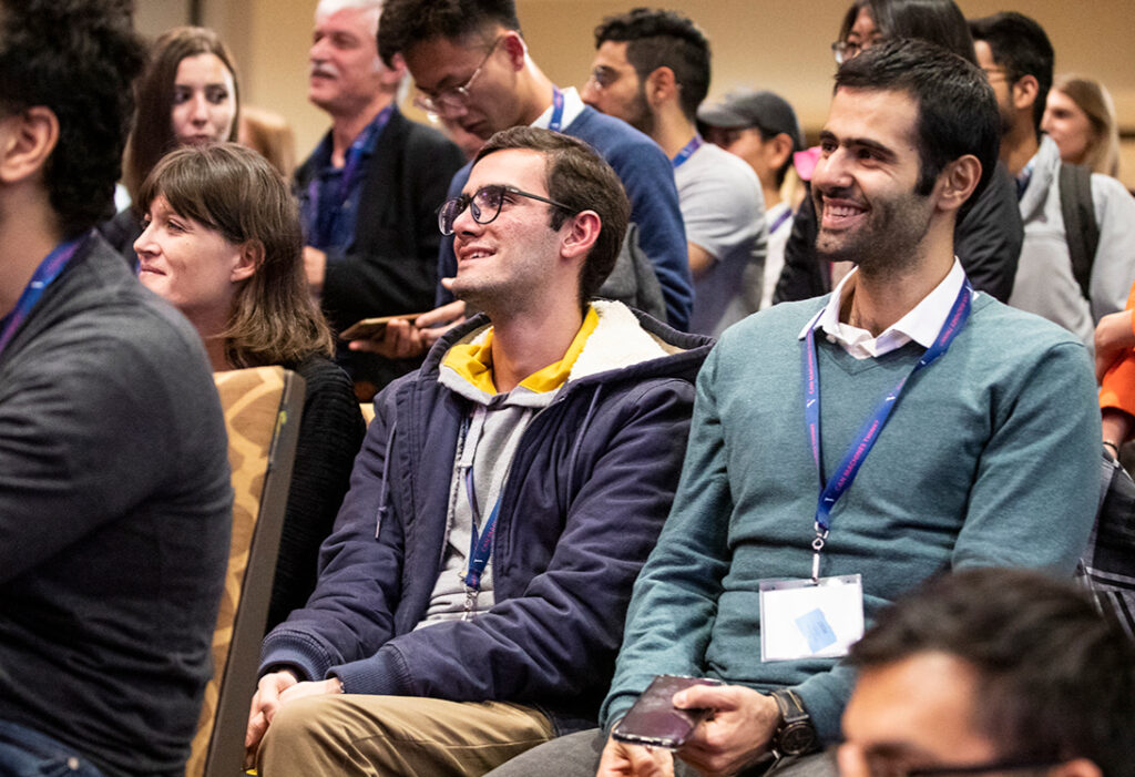 Conference attendees sitting in the audience