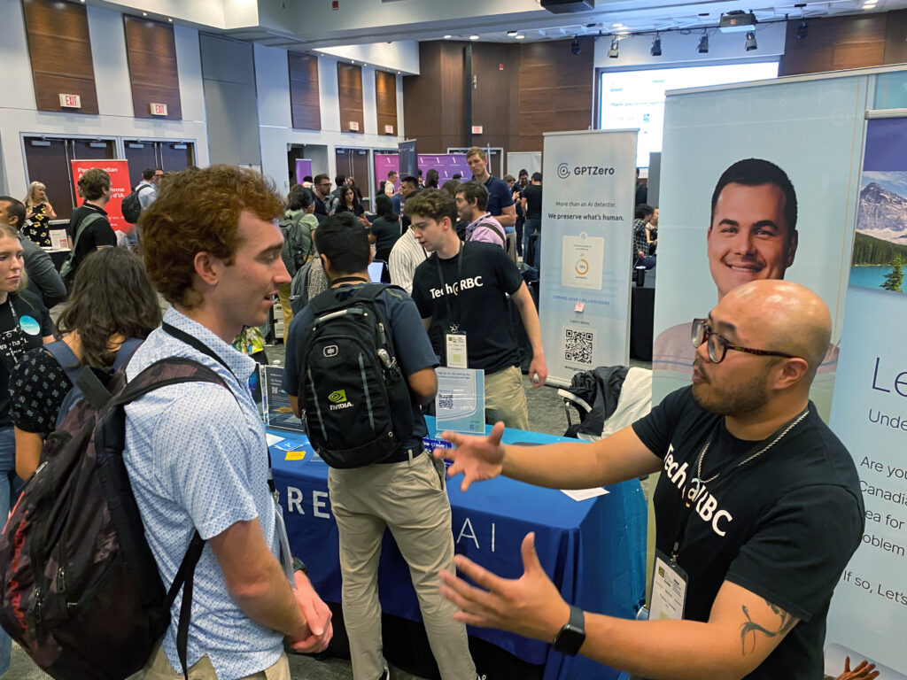 CIFAR Summer School - Image 2 - Students at booths - Annual Report 2024-25