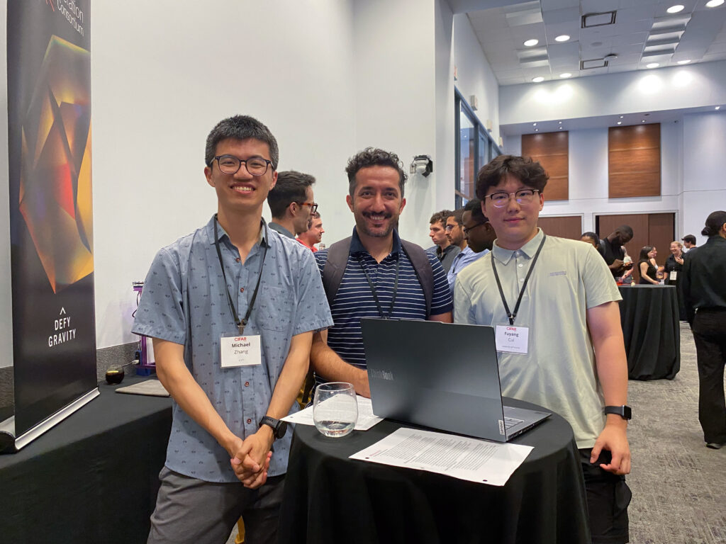 CIFAR Summer School - Image 4 - 3 students around laptop - Annual Report 2024-25