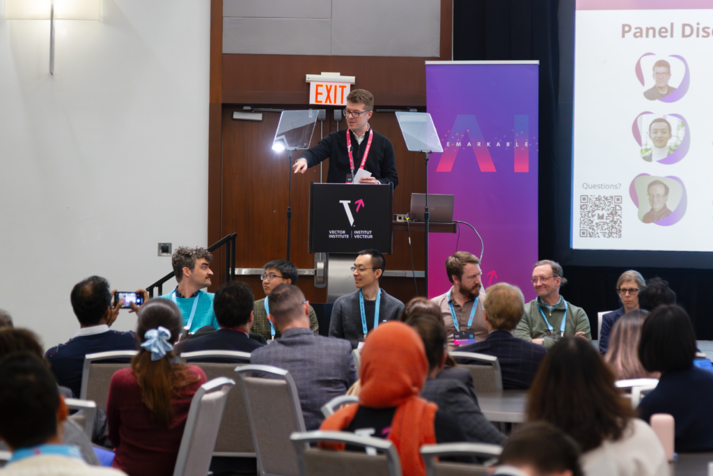 Frank Rudzicz (Associate Professor, Faculty of Computer Science, Dalhousie University; Associate Professor, Department of Computer Science, University of Toronto; Canada CIFAR Artificial Intelligence Chair) pointing to an audience member during a breakout session at Vector Event Remarkable 2025