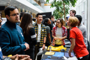 People crowding around table at the Vector 2019 Research Symposium and Job Fair