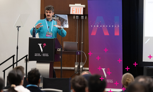 A person speaking at a podium with Vector branding
