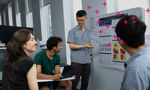 A group of people talking about a research poster at Vector's office