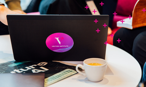 Laptop with Vector logo sticker on it