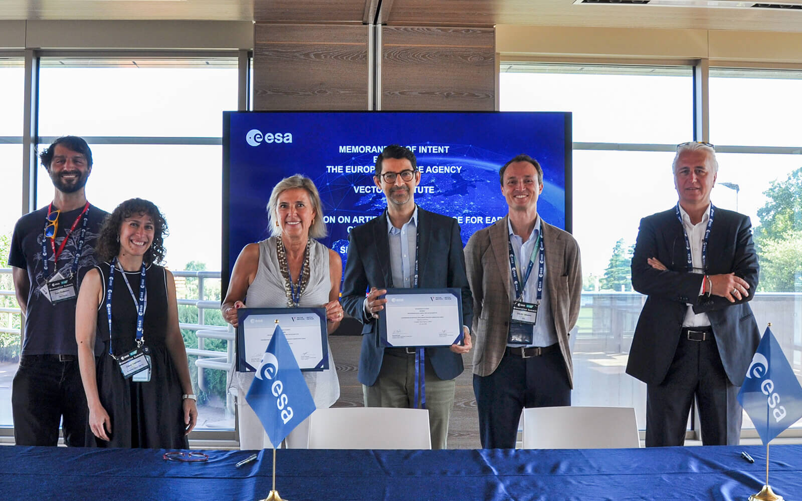 Vector Institute and European Space Agency representatives presenting certificates.